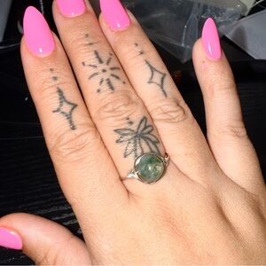 Custom $7 wire wrapped rings in show. Custom sizing